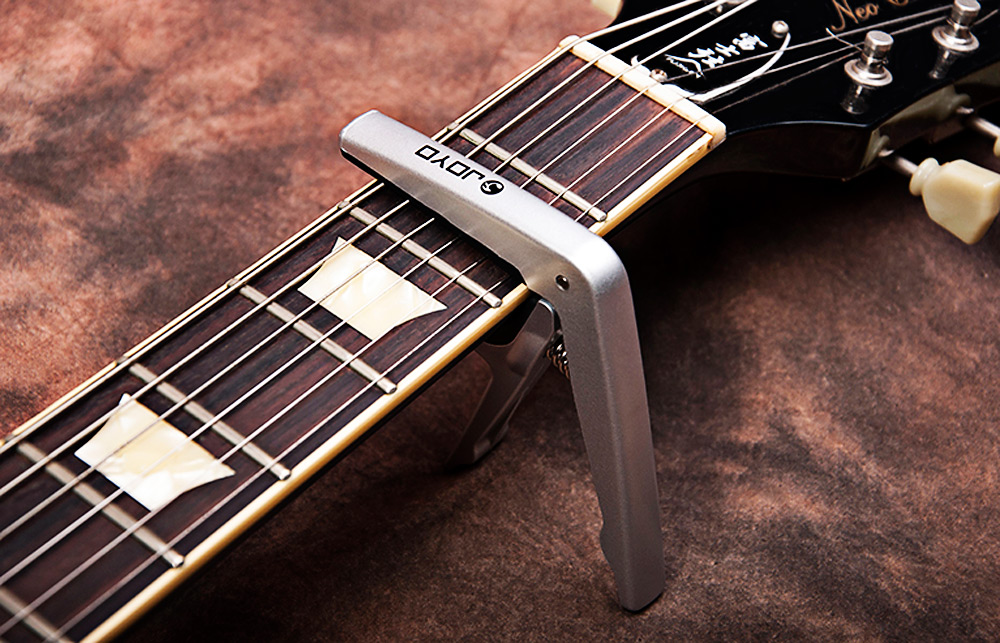 JOYO JCP - 01 Light Professional Capo with Pick for String Acoustic Electric Guitar JOYO JCP - 01 Light Professional Capo with Pick for String Acoustic Electric Guitar